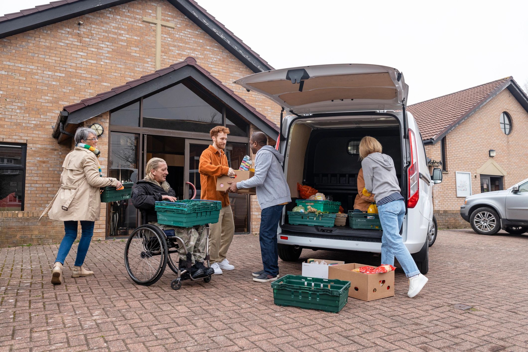 Volunteers unloading food donations for community support