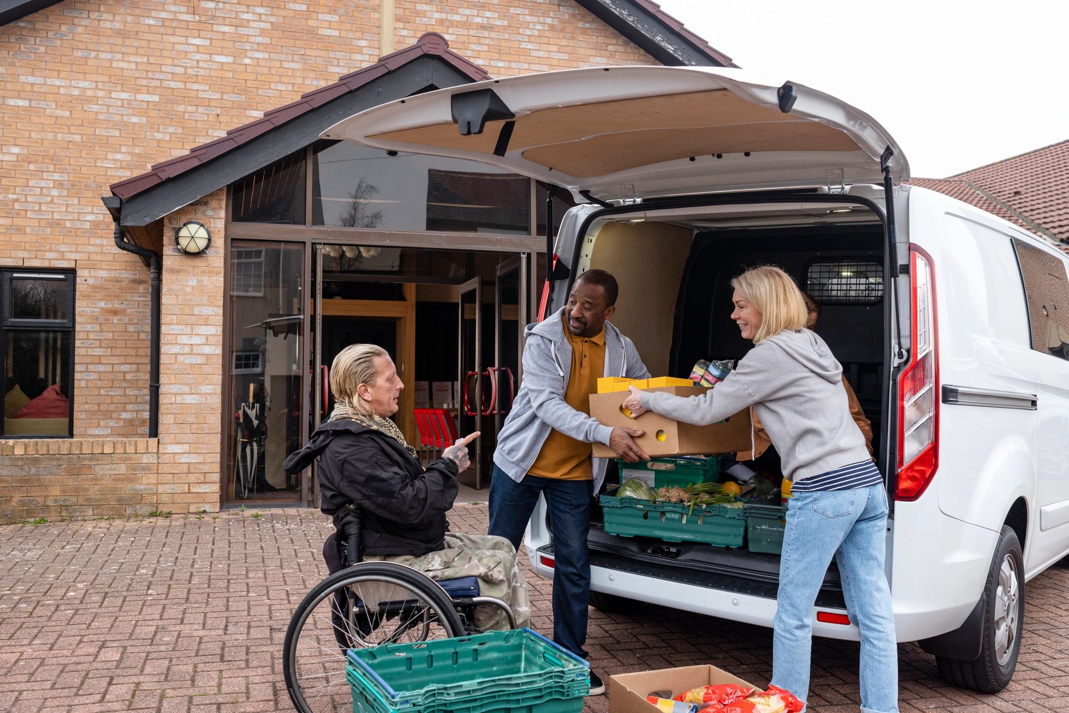 Volunteers working together to unload food donations