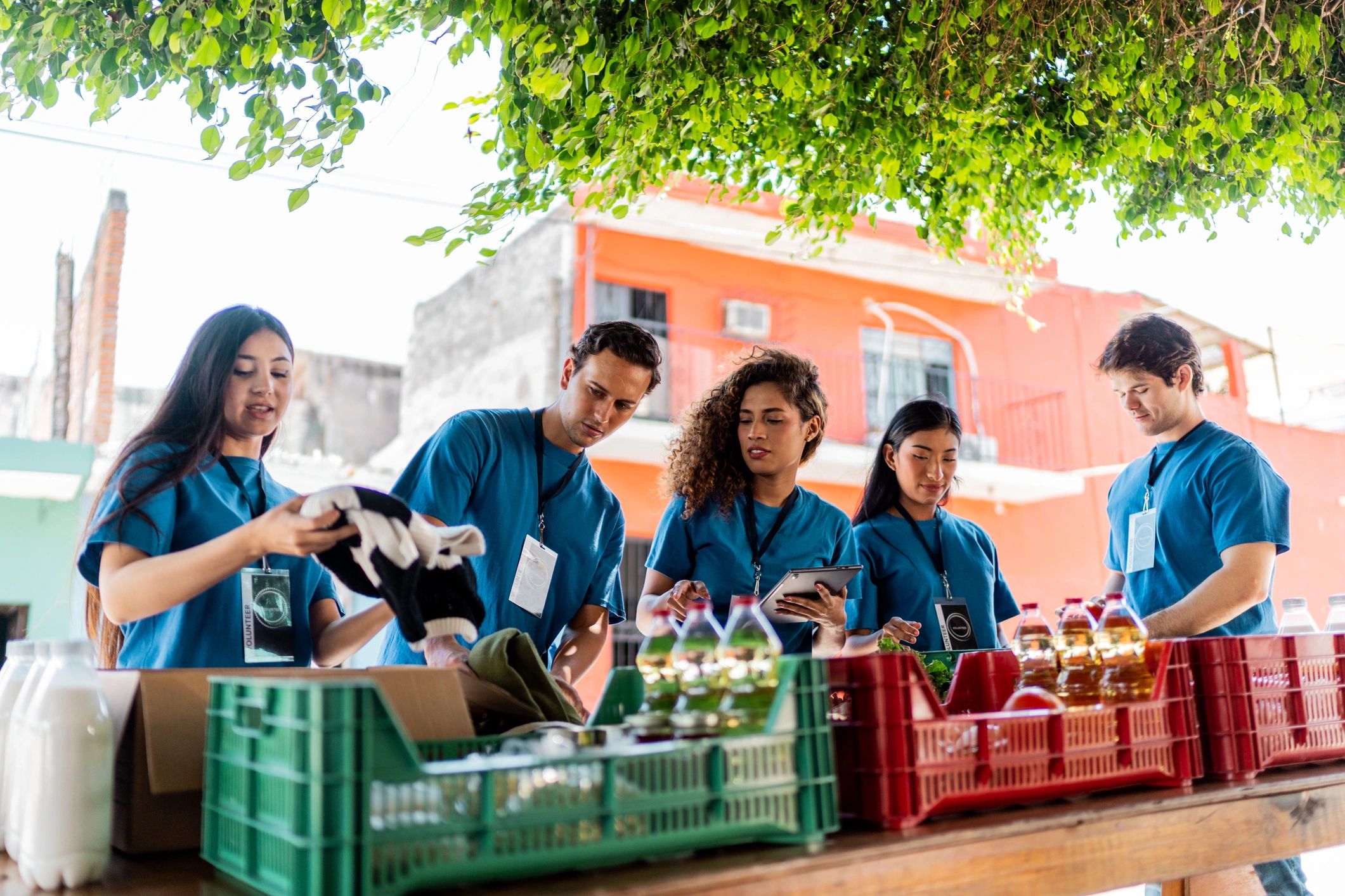 Volunteers packing donated supplies outdoors